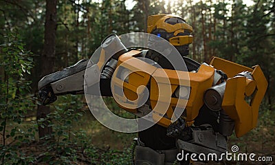 Robot transformer Bumblebee stands among forest Editorial Stock Photo