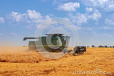 Dnipro. Ukraine 10 July 2021. harvesting wheat. Combine harvester collects spikelets of wheat. Agriculture Editorial Stock Photo