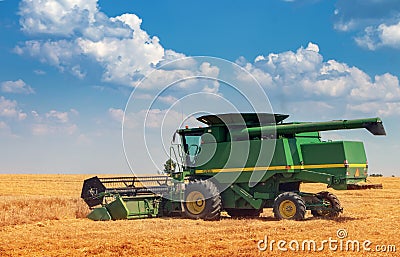 Dnipro. Ukraine 10 July 2021. harvesting wheat. Combine harvester collects spikelets of wheat. Agriculture Editorial Stock Photo