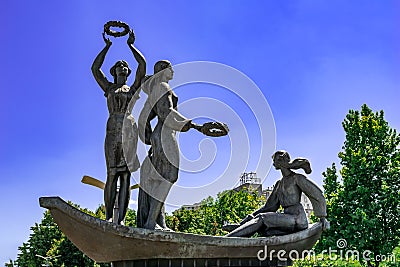 Youth of the Dnipro Sculpture on Sicheslavska embankment. Three bronze Ukrainian girls with Editorial Stock Photo