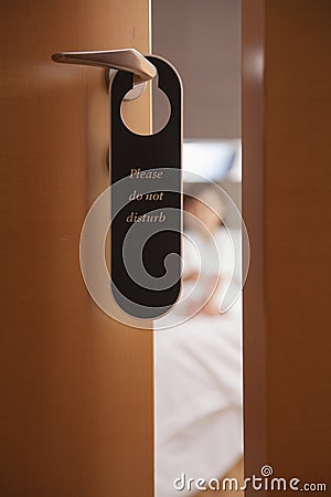 Do not disturb sign on the hotel door, close-up Stock Photo