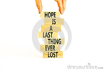 Do not lost hope symbol. Concept words Hope is a last thing ever lost on wooden blocks on a beautiful white background. Stock Photo