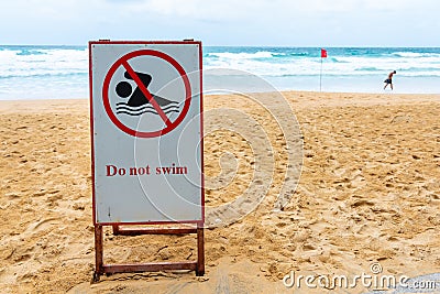 Do not swim sign at dangerous area beach Stock Photo