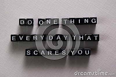 Do one thing everyday that scares you on wooden blocks. Motivation and inspiration concept Stock Photo