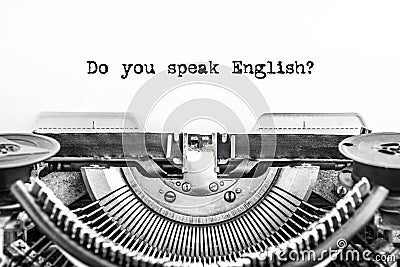Do you speak English? typed text on a Vintage Typewriter, old paper, closeup. Stock Photo
