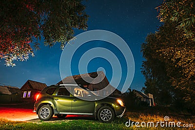 Dobrush, Belarus. Renault Duster Suv Car Parking On Street Under Night Starry Sky Above Renault Duster Suv. Duster Editorial Stock Photo