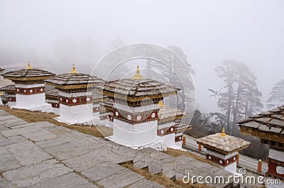 Dochu La Pass with 3-layered chortens stupas, on central hillock, along east-west road from Thimpu to Punakha, Bhutan Stock Photo