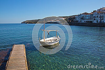 Dock and boat in Cadaques Bay Stock Photo
