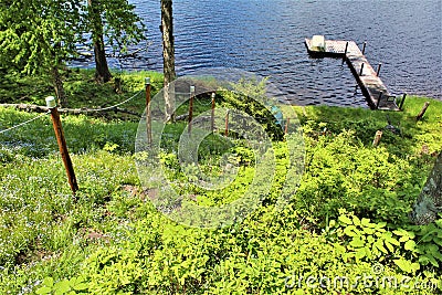 Dock at Leonard Pond located in Childwold, New York, United States Stock Photo