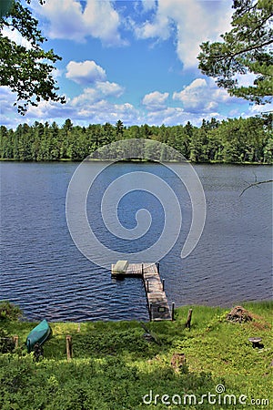 Dock at Leonard Pond located in Childwold, New York, United States Stock Photo