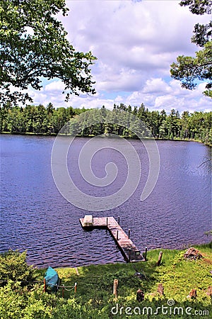 Dock at Leonard Pond located in Childwold, New York, United States Stock Photo