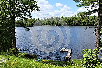 Dock at Leonard Pond located in Childwold, New York, United States Stock Photo
