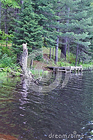 Dock at Leonard Pond located in Childwold, New York, United States Stock Photo