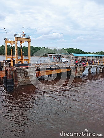 dock sea sky claoud briged water Editorial Stock Photo