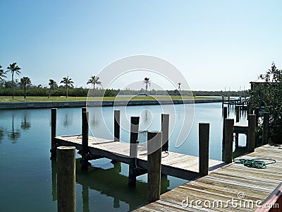 Dock on the water on pleasant sunny day. Stock Photo