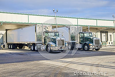 Docked Times Transport Trucks At The Receiving Docks Of The St. Petersburg Plant Editorial Stock Photo