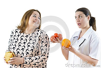 Doctor Advising a Corpulent Woman to Eat Healthy Stock Photo