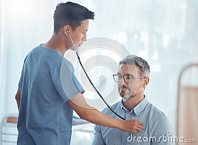 Doctor, asian man and listening with stethoscope to patient heartbeat, healthcare consultation and cardiology test in Stock Photo