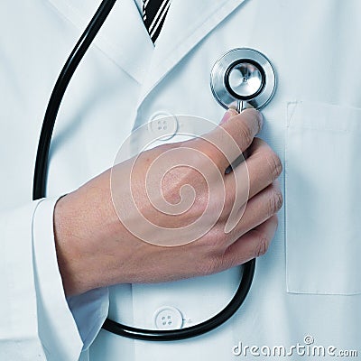 Doctor auscultating himself with a stethoscope Stock Photo