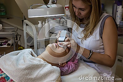 Doctor beautician at work Stock Photo