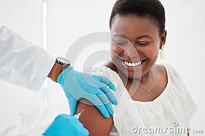 Doctor, black woman and vaccine injection with smile for safety, immunity and prevention. Covid, healthcare and medical Stock Photo