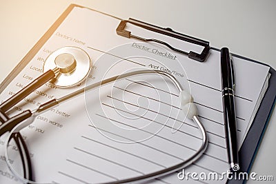 Doctor check list with stethoscope and pen Stock Photo