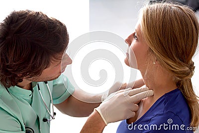 Doctor checking lymph nodes Stock Photo