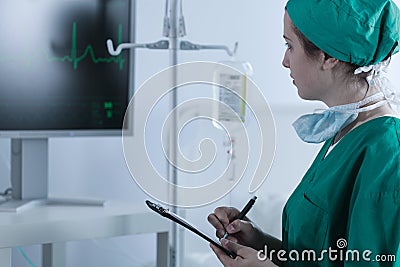 Doctor checking patient heartbeat Stock Photo