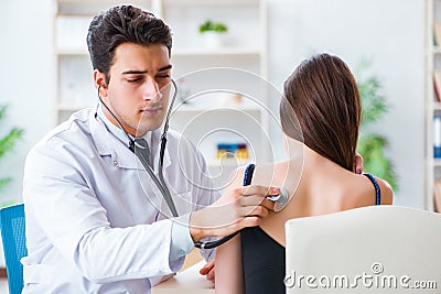 The doctor checking patients ear during medical examination Stock Photo