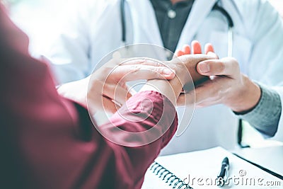 Doctor checking pulse for patients Health care in hospital Stock Photo