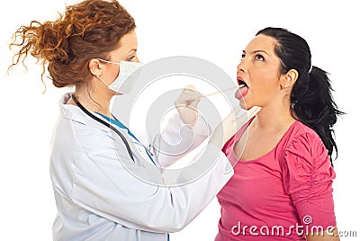 Doctor checking for sore throat Stock Photo