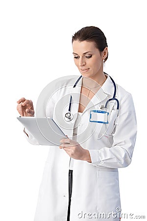 Doctor checking tablet computer Stock Photo