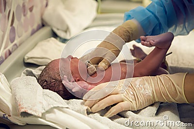 Doctor checks the newborn Stock Photo