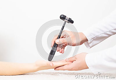 The doctor checks the palmar chin reflex in the palm of the patient. Verification and treatment of vegetative vascular dystonia Stock Photo