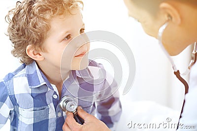 Doctor and child patient. Physician examines little boy by stethoscope. Medicine and children`s therapy concept Stock Photo