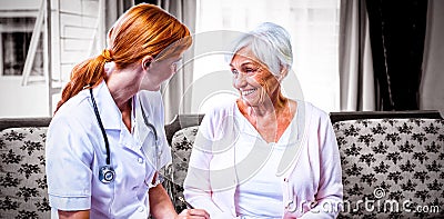 Doctor consulting with senior woman Stock Photo