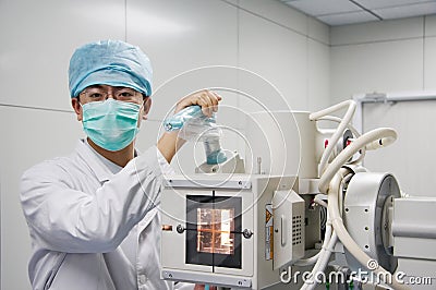 Doctor controlling X-ray instrument Stock Photo