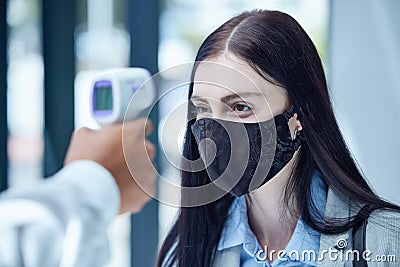 Doctor, covid and thermometer for healthcare scan to test patient temperature or check for fever or symptoms Stock Photo