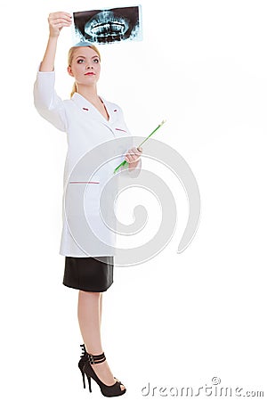 Doctor dentist looking at dental xray scan film isolated Stock Photo