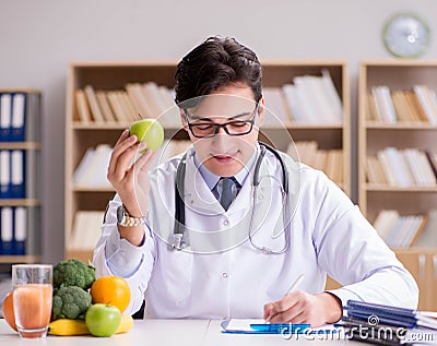 Doctor in dieting concept with fruits and vegetables Stock Photo