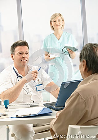 Doctor discussing diagnosis with patient Stock Photo