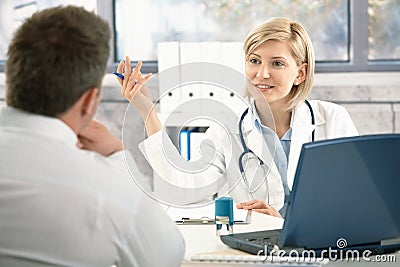 Doctor discussing diagnosis with patient Stock Photo