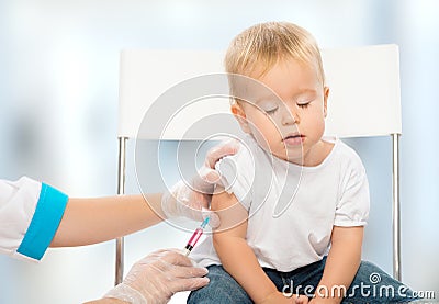 Doctor does injection child vaccination baby Stock Photo