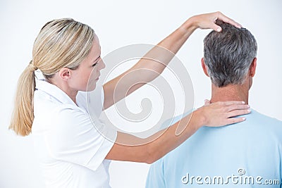 Doctor doing a neck adjustment Stock Photo