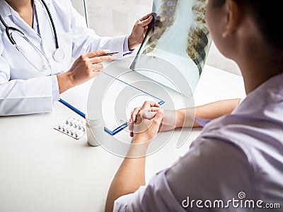 Doctor evaluated the chest x-ray and advise patients on health care Stock Photo