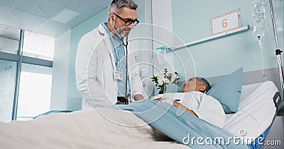 Doctor exam, hospital and stethoscope with a patient for cardiology, healthcare and heart problem. Ward, nursing and a Stock Photo