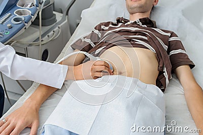 Doctor examination a man at abdomen Usg Stock Photo