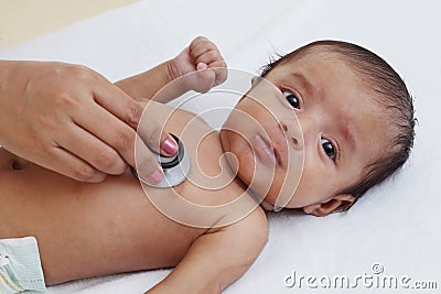 Doctor examine newborn with stethoscope Stock Photo