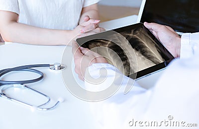 The doctor examined the patient and looked Stock Photo
