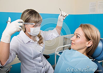 Doctor examines the oral cavity on tooth decay. Caries protection. Tooth decay treatment. Dentist working with dental Stock Photo